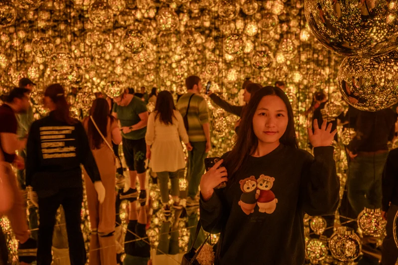 Large open room with light balls hanging from the ceiling